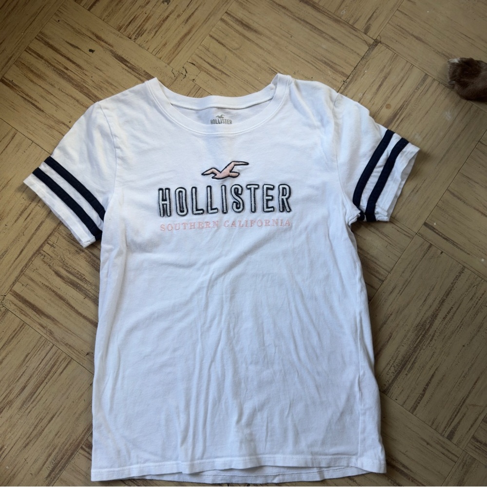 Hollister White Tee with Navy Sleeve Stripes and Pink Logo